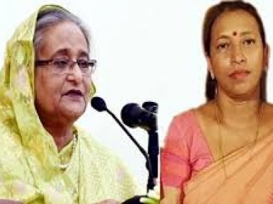 Sheikh Hasina stands beside Priya Saha 