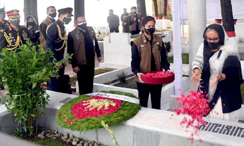 PM Hasina pays tributes at the burial of her relatives