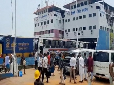 People, vehicles crossing Padma River on ferry without suffering