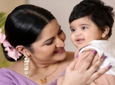 Porimoni returns home from hospital with son Rajya